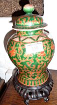 Chinese porcelain jar and cover on carved hardwood stand, 20cm tall