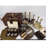 A basket containing a quantity of plated ware and a small quantity of brass ware,