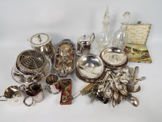 A quantity of plated ware, flatware, two decanters and other, generally good condition,