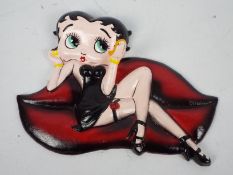 A wall mountable, cast iron model depicting Betty Boop, approximately 19 cm (l),