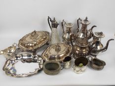 A collection of plated ware to include teapot, coffee pot and other, some plating loss in areas.