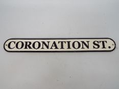 A cast iron street sign, Coronation Street, approximately 8 cm x 62 cm,