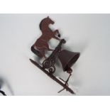 A wall mountable, cast iron bell with horse surmount, approximately 42 cm (h),