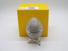 A crystal encrusted egg form trinket box