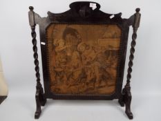 A wood framed fire screen, approximately 70 cm x 63 cm.