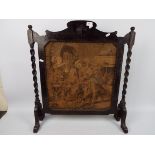 A wood framed fire screen, approximately 70 cm x 63 cm.