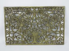 A cast iron doormat, approximately 45 cm x 69 cm,