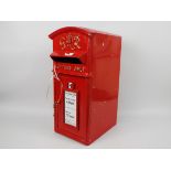 A reproduction, red painted, cast iron postbox with two keys, 59 cm (h),