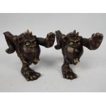 A pair of bronzed, cast iron bookends in the form of stylised gorillas, approximately 14 cm (h),