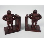 A pair of cast iron Bibendum (Michelin Man) bookends, approximately 13 cm (h),