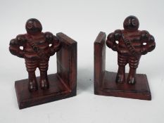 A pair of cast iron Bibendum (Michelin Man) bookends, approximately 13 cm (h),