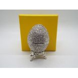 A crystal encrusted egg form trinket box