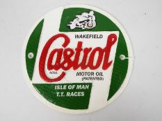 A cast iron wall plaque marked Castrol Motor Oil Isle Of Man T.T.