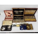 A collection of cased / boxed, plated flatware and two vanity sets.
