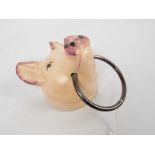 A cast iron, wall mountable model of a pig's head, approximately 20 cm,