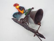 A cast iron, wall mountable, bell with cockerel decoration, approximately 45 cm (h),