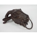 A cast iron, wall mountable, rams head, approximately 23 cm,
