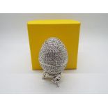 A crystal encrusted egg form trinket box