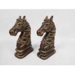 A pair of bronzed, cast iron, book ends in the form of horse heads, approximately 23 cm (h),