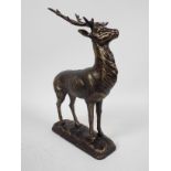 A bronzed, cast iron figure depicting a stag, approximately 29 cm (h),