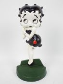 A cast iron door stop in the form of Betty Boop, approximately 36 cm (h),