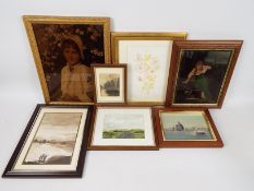 A collection of framed pictures includin