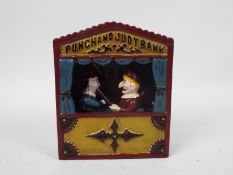 A cast iron, Punch & Judy money bank, approximately 18 cm (h),