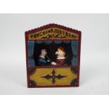 A cast iron, Punch & Judy money bank, approximately 18 cm (h),