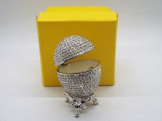 A crystal encrusted egg form trinket box