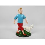 A cast iron doorstop in the form of Tintin and Snowy, approximately 33 cm (h),