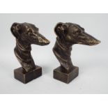 A pair of bronzed, cast iron, greyhound heads, approximately 23 cm (h),