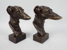 A pair of bronzed, cast iron, greyhound heads, approximately 23 cm (h),