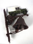 A wall mountable, cast iron bell with Land Rover surmount, approximately 34 cm (h),