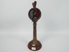 A brass model of a ships's engine room order telegraph. Approximately 40 cm (h).