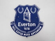 A cast iron wall plaque marked Everton, 24 cm x 23 cm,