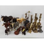 A collection of metalware to include brass candlesticks and similar and a quantity of horse models.