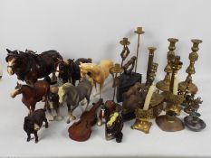 A collection of metalware to include brass candlesticks and similar and a quantity of horse models.