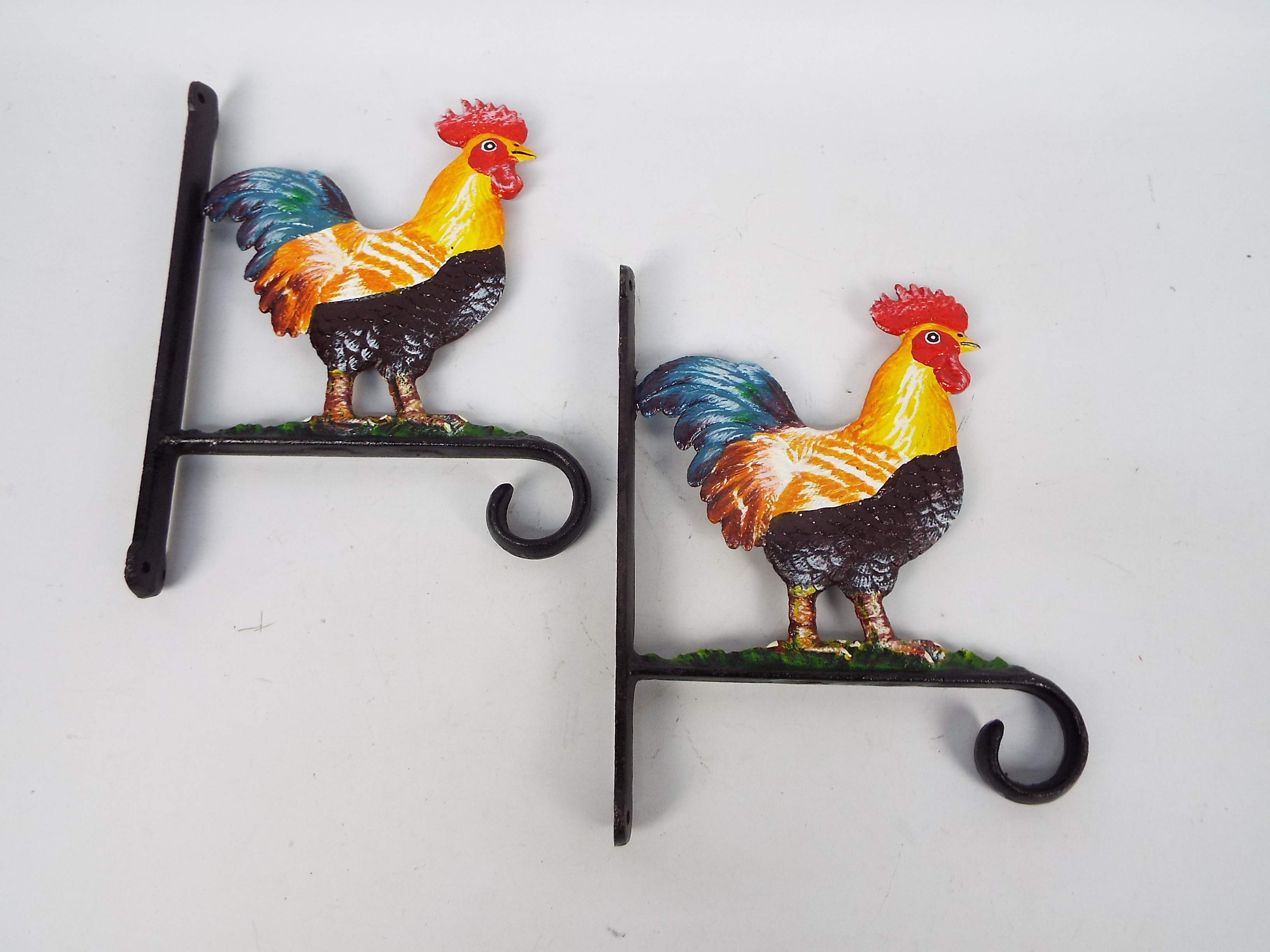 Two cast iron flower basket hangers with