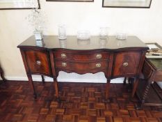 A sideboard having twin drawers flanked