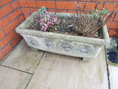 A reconstituted stone rectangular planter,