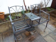 A garden table flanked by twin seats,