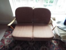 An Ercol, stick back, two seat settee, a