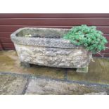 A reconstituted stone rectangular planter,