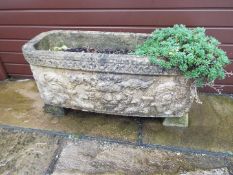 A reconstituted stone rectangular planter,