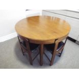 A circular kitchen table with four close-fitting dining chairs, 75 cm (h) x 105 cm (diam),