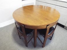 A circular kitchen table with four close-fitting dining chairs, 75 cm (h) x 105 cm (diam),