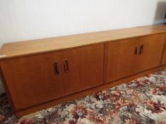 G Plan Furniture - a teak low chest of twin cupboards, 54 cm x 162 cm x 45 cm,