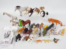 27 x plastic animals to include a lion,