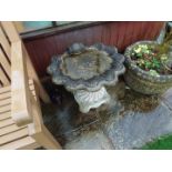 A reconstituted stone bird bath of shell form, 59 cm NOTE: ITEM IS LOCATED IN ST HELENS,
