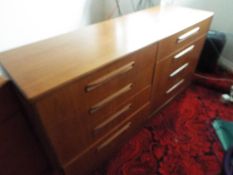 G Plan Furniture - a teak chest of 8 drawers, 76 cm x 142 cm x 44 cm,